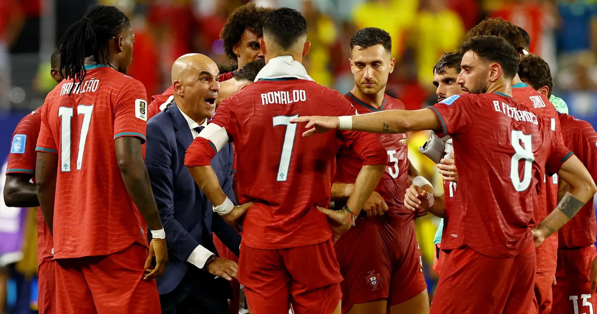 Portugal players discussing tactics during a match