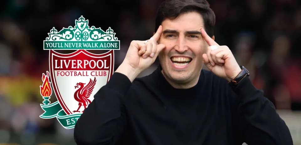 Coach gesturing enthusiastically with Liverpool logo background