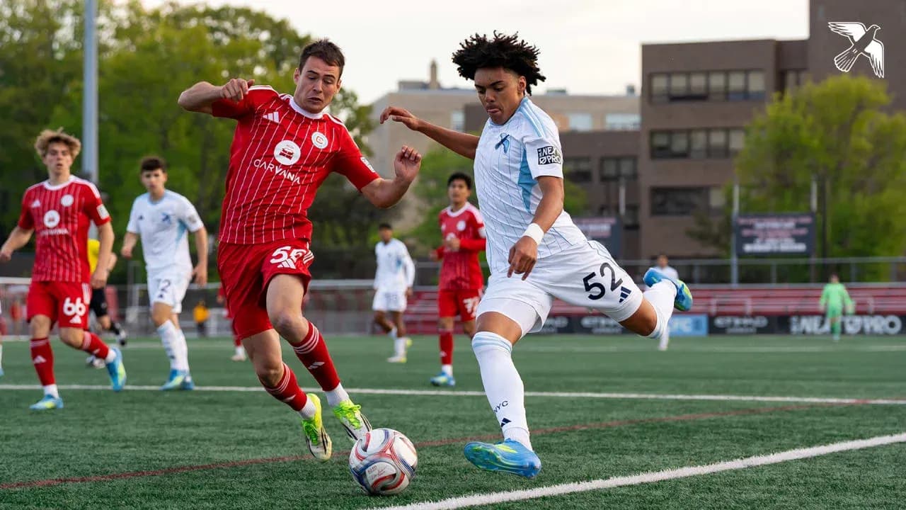 Players competing for the ball in MLS Next Pro match