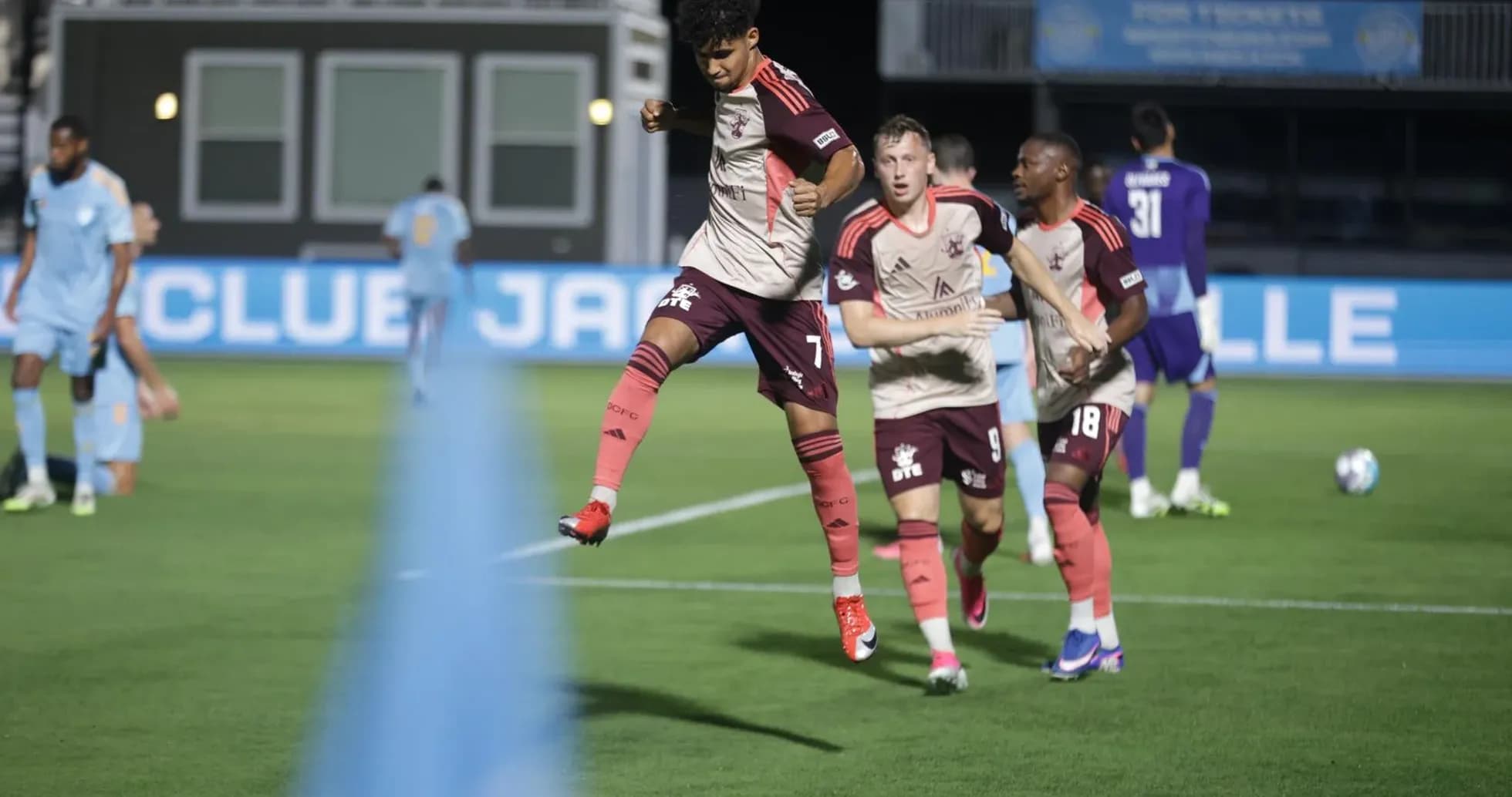 Player celebrating after scoring against Detroit City