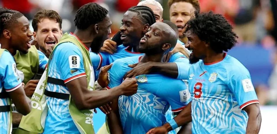 Players celebrating a goal during a match