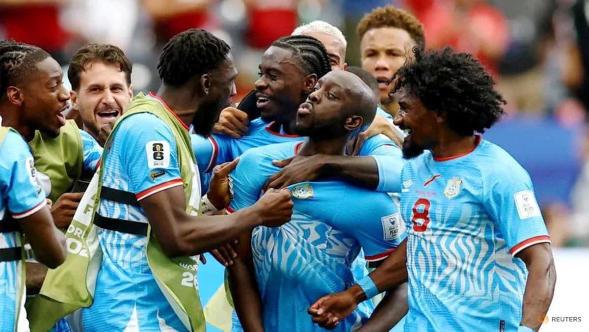 Players celebrating a goal during a match