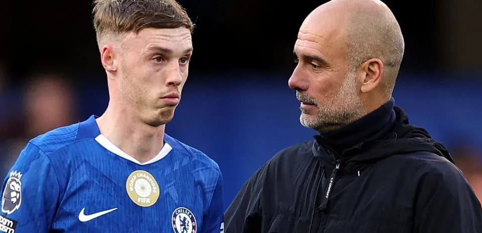 Player and coach discussing on the pitch