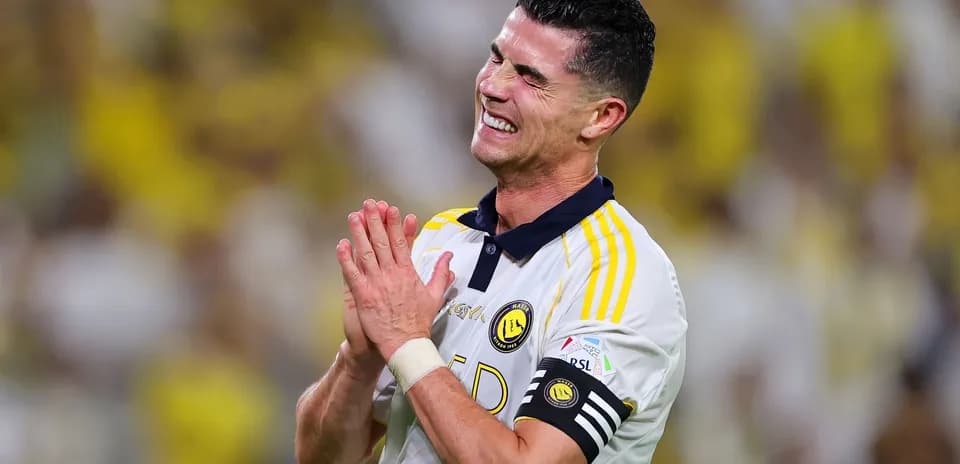 Player celebrating in team's jersey on the field