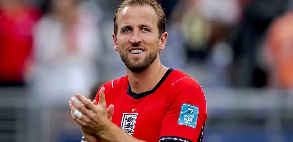 Player applauding in red jersey during match