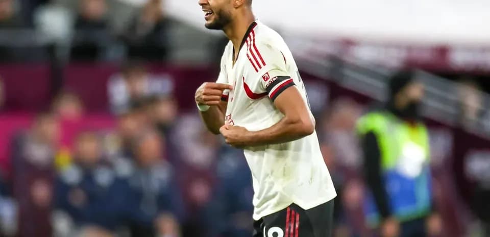 Player reacting during match with jersey number 18
