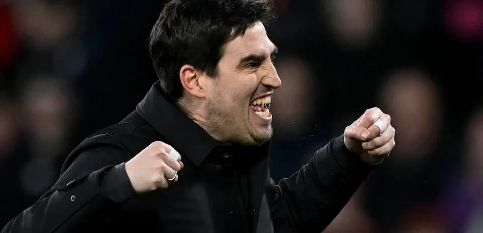 Coach celebrating enthusiastically during a match