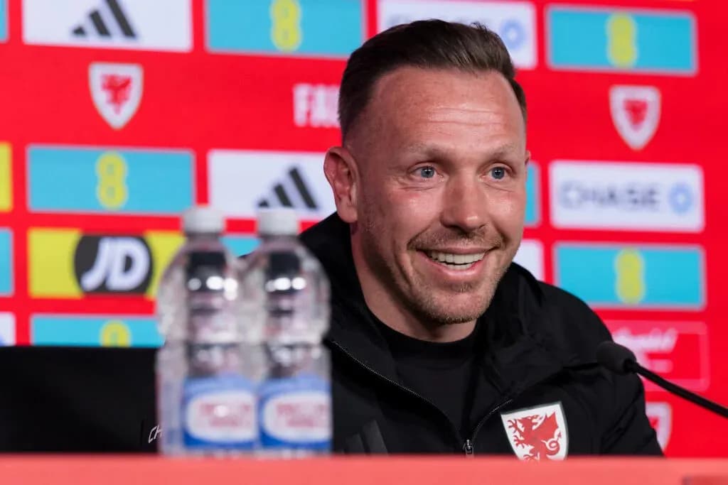 Manager at press conference with water bottles