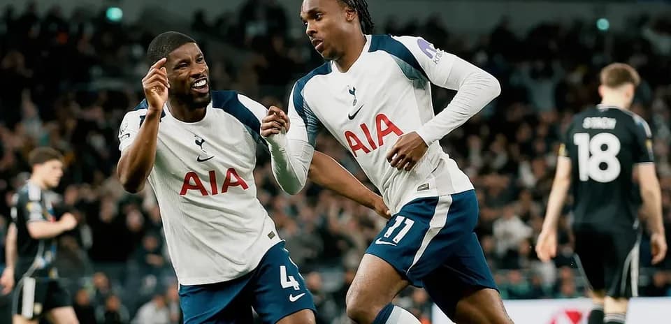 Two Tottenham players celebrating a goal