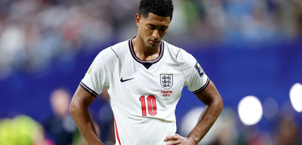 England player with head down during match