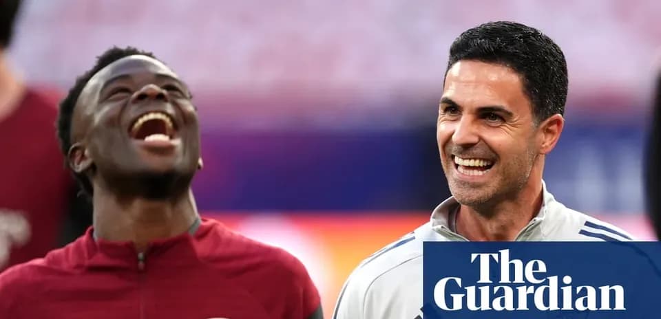 Player and coach smiling during training session