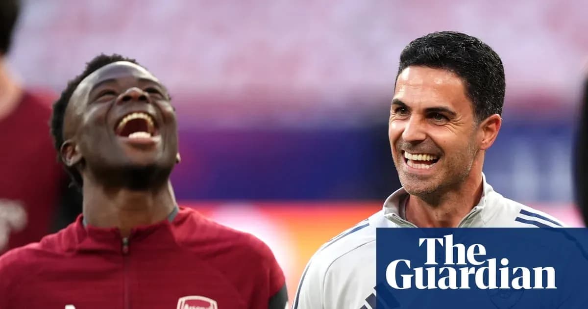 Player and coach smiling during training session