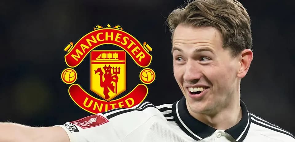 Player celebrating with Manchester United logo background