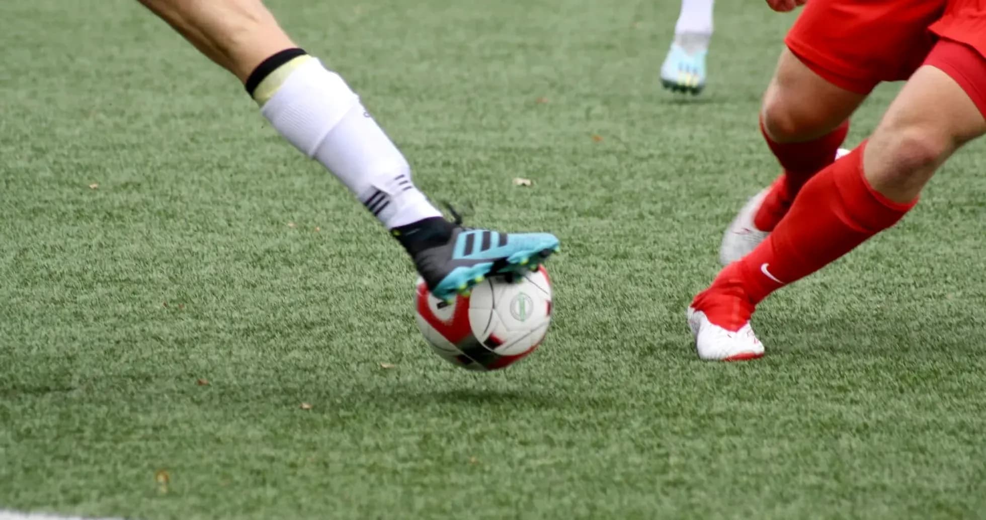 Players contesting for the ball during match