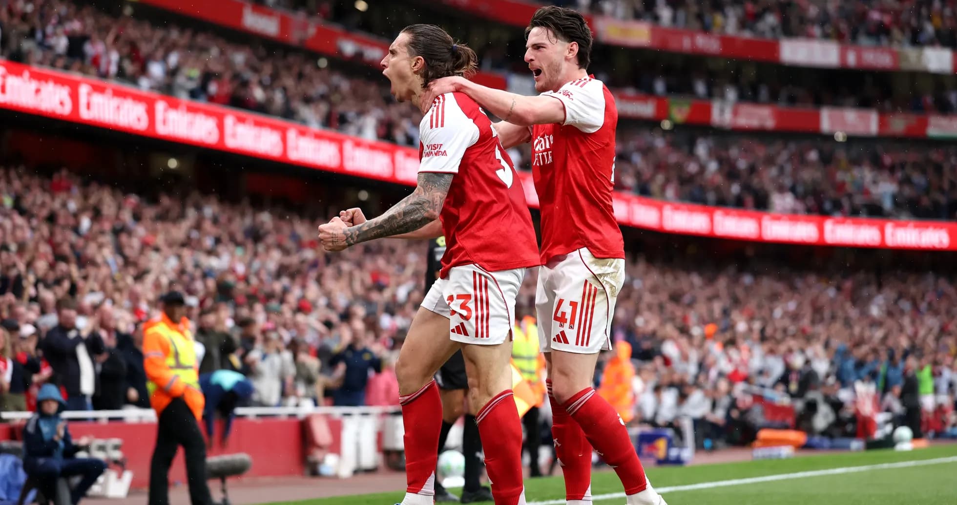 Arsenal players celebrating a goal at Emirates Stadium