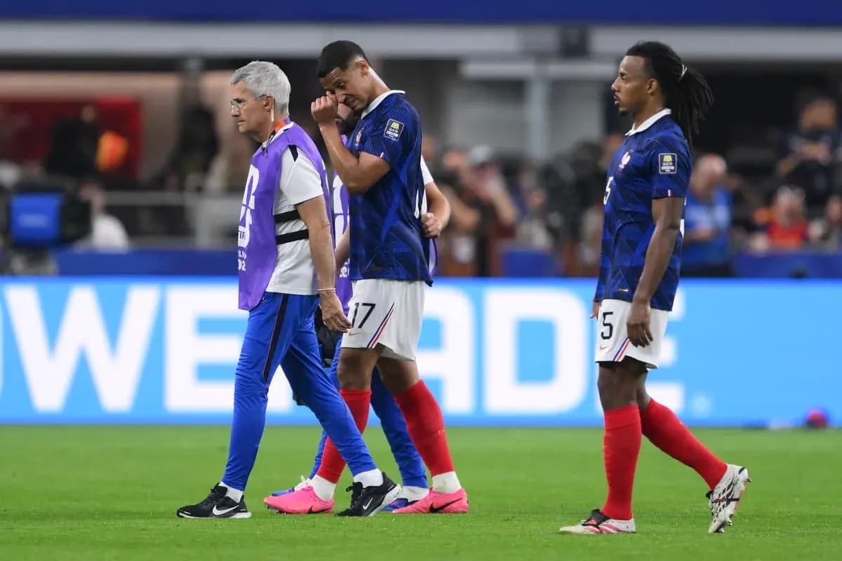 French players walking off the pitch after match