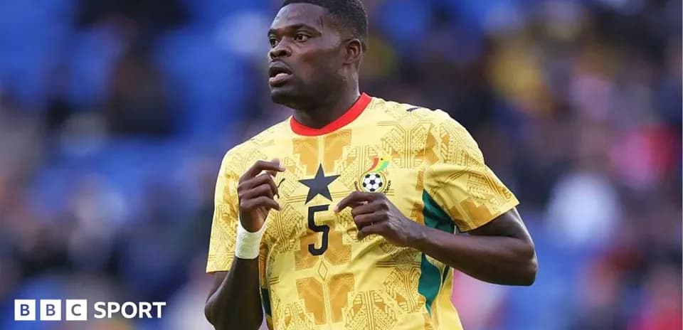 Ghana player in yellow jersey during match