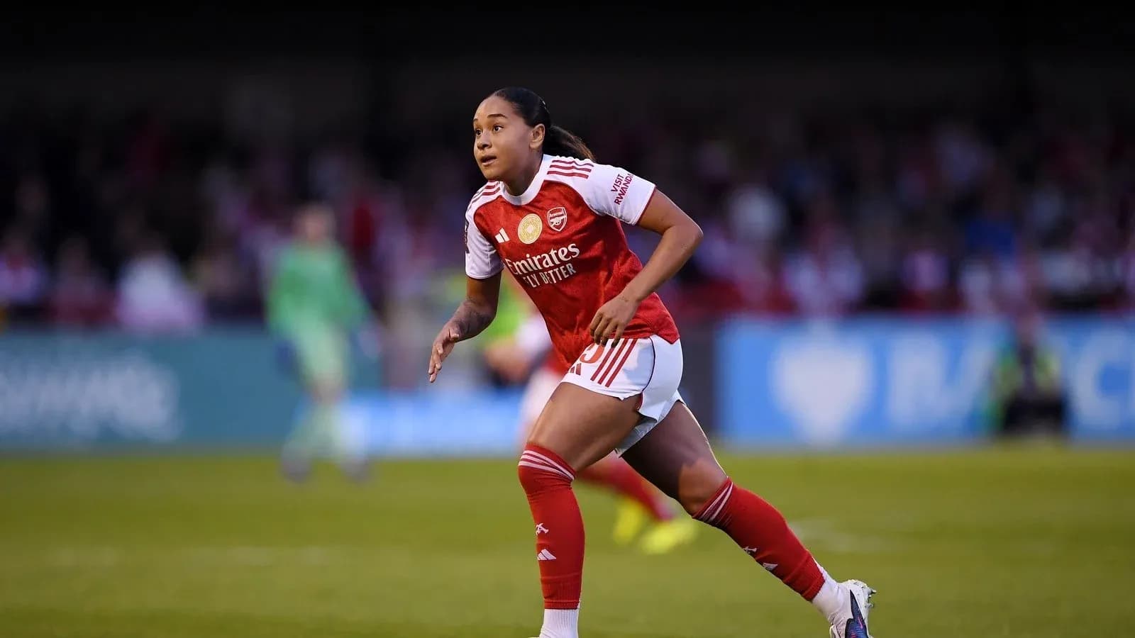 Arsenal player running on the pitch during match