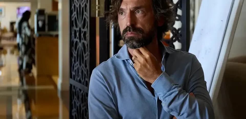 Man in blue shirt thinking in a hotel lobby