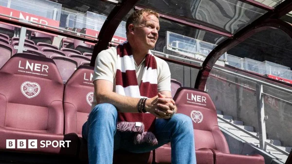 Manager seated in dugout at stadium