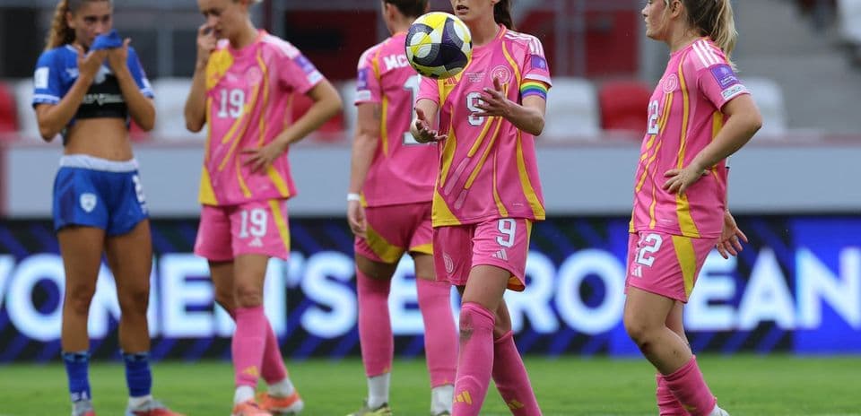 Players in pink and blue jerseys on the field