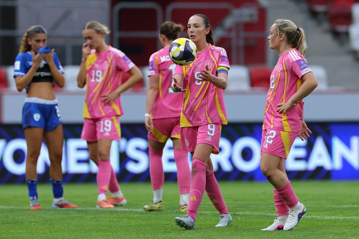 Players in pink and blue jerseys on the field