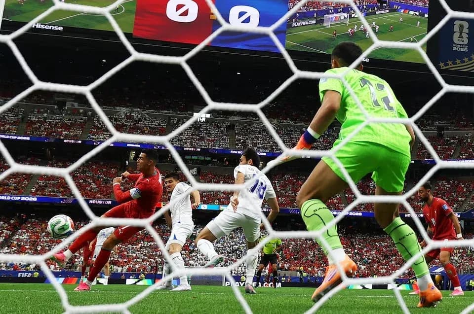 Goalkeeper preparing to save shot during match