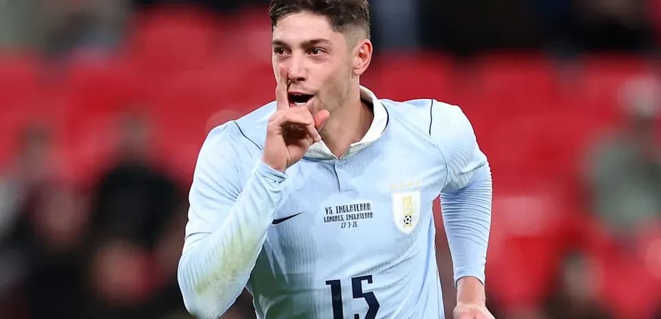 Player celebrating and shushing fans after scoring