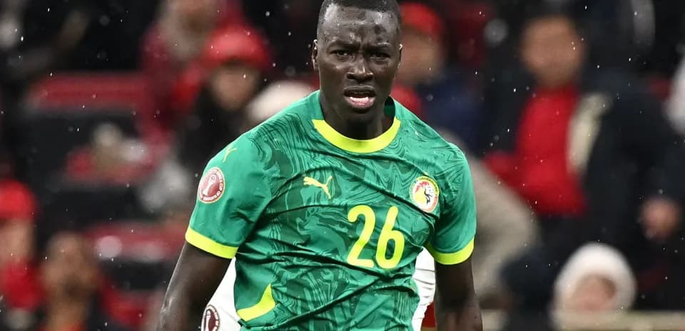 Player in green jersey during football match action
