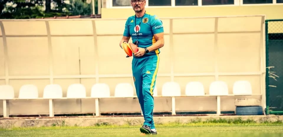 Coach holding training cones on the field