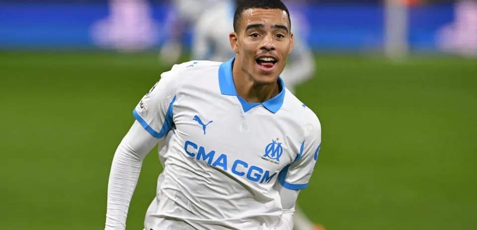 Player celebrating a goal in Marseille jersey