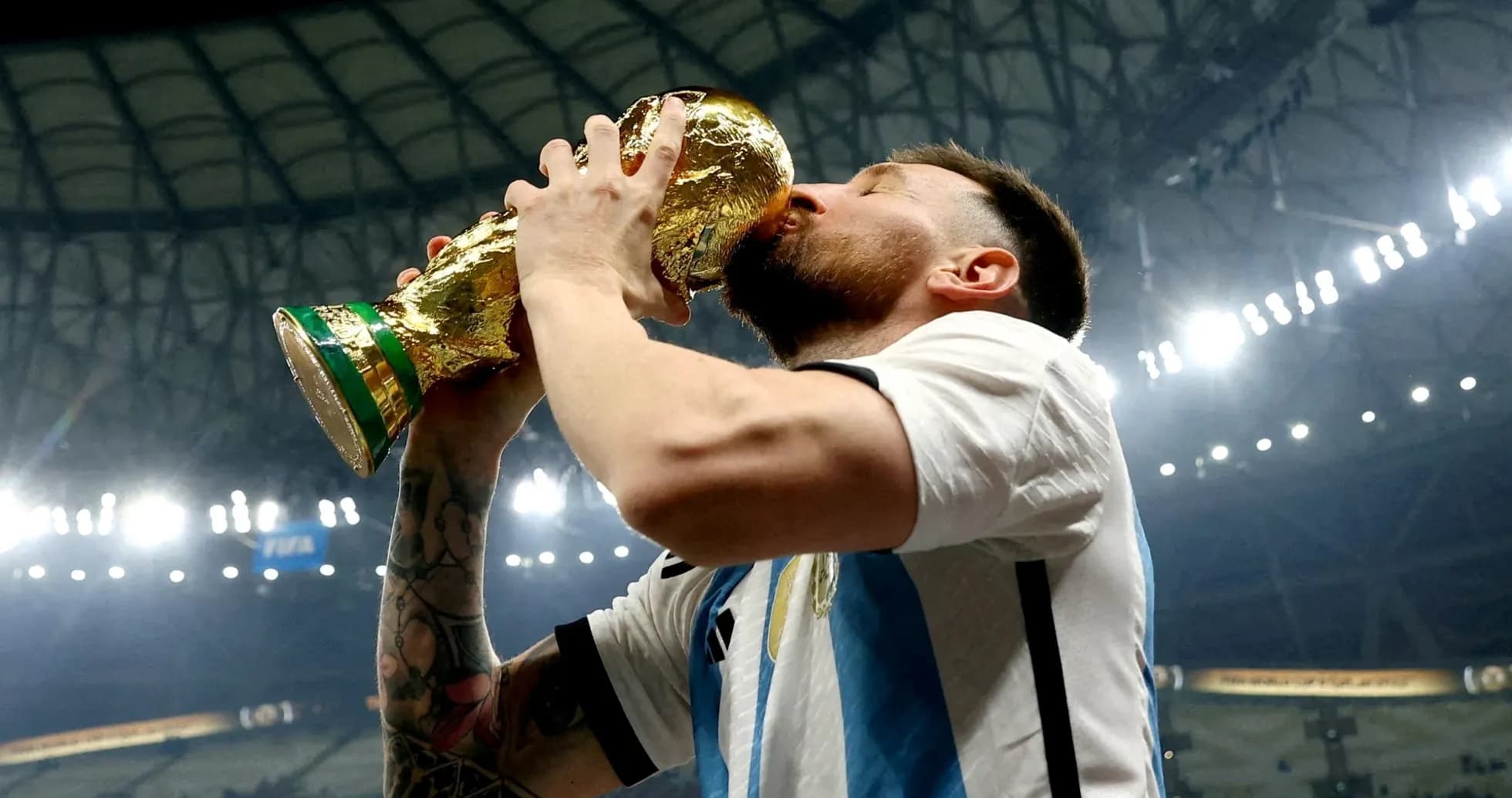 Player kissing the FIFA World Cup trophy