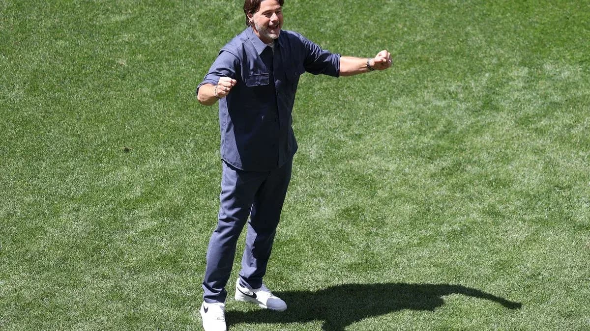 Coach celebrating on the field during training session