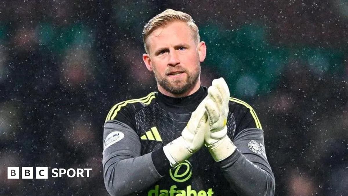 Goalkeeper clapping in snowy match conditions