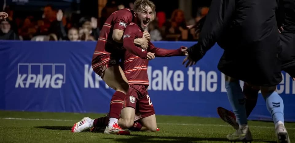 Players celebrating a goal during football match