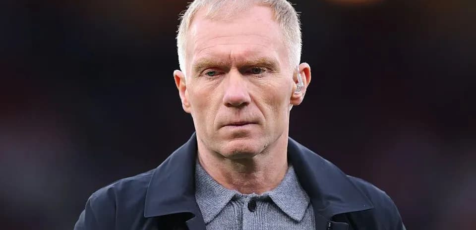 Man in formal attire at a sports event