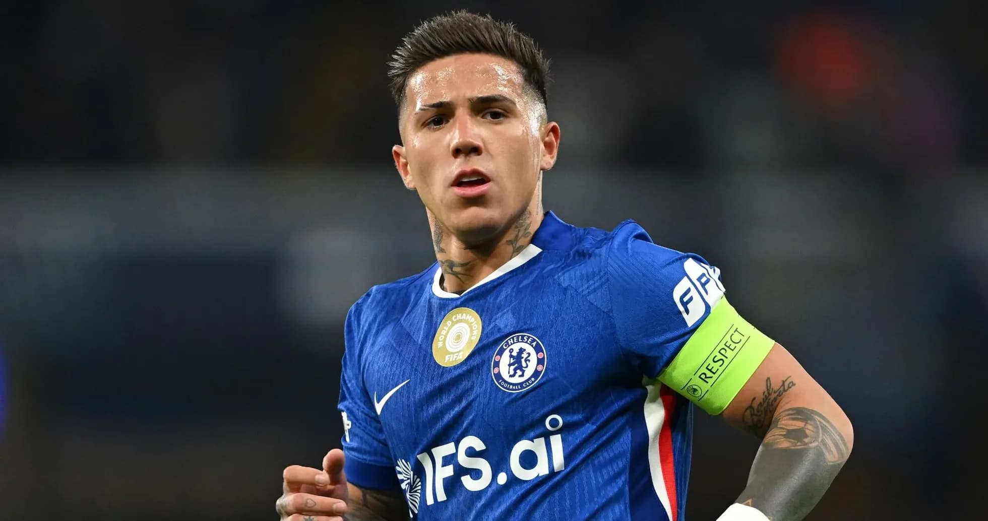 Player wearing Chelsea jersey with captain's armband