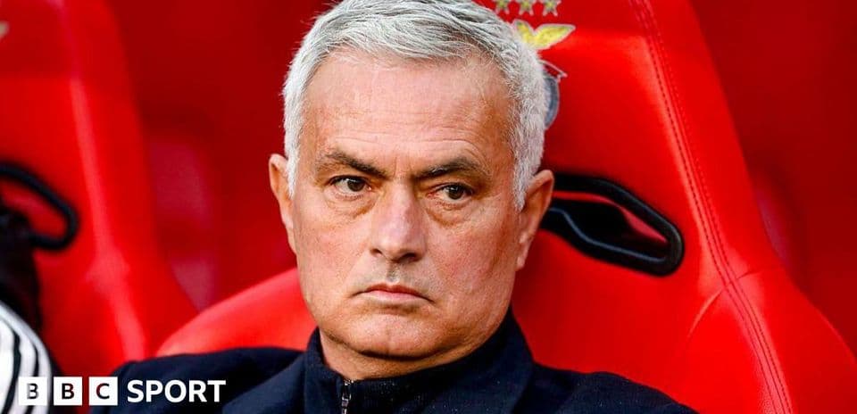 Coach sitting on bench during match