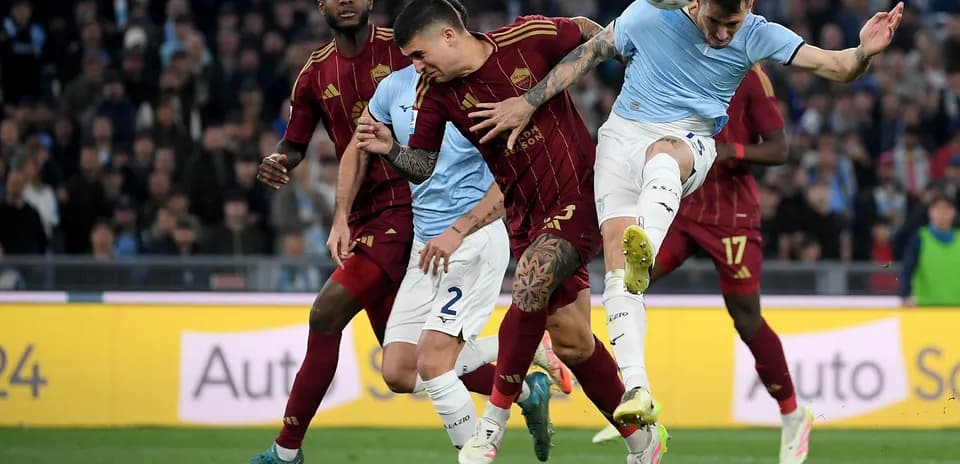 Players competing for the ball during derby match