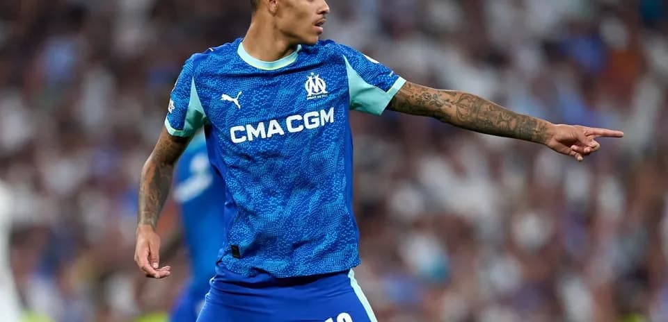 Player in Marseille jersey directing teammates on field