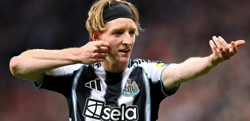 Newcastle player celebrating a goal on the field