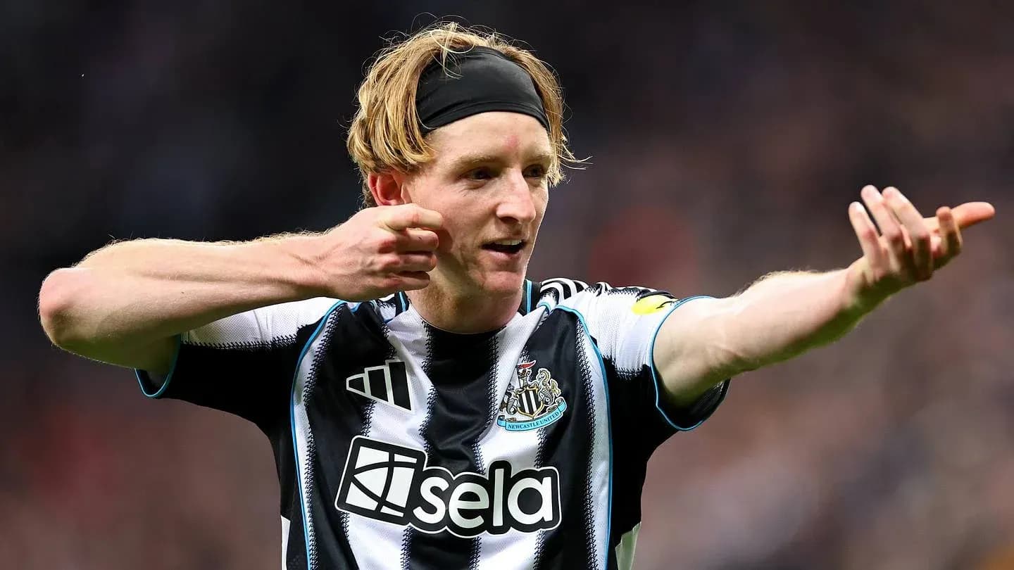 Newcastle player celebrating a goal on the field