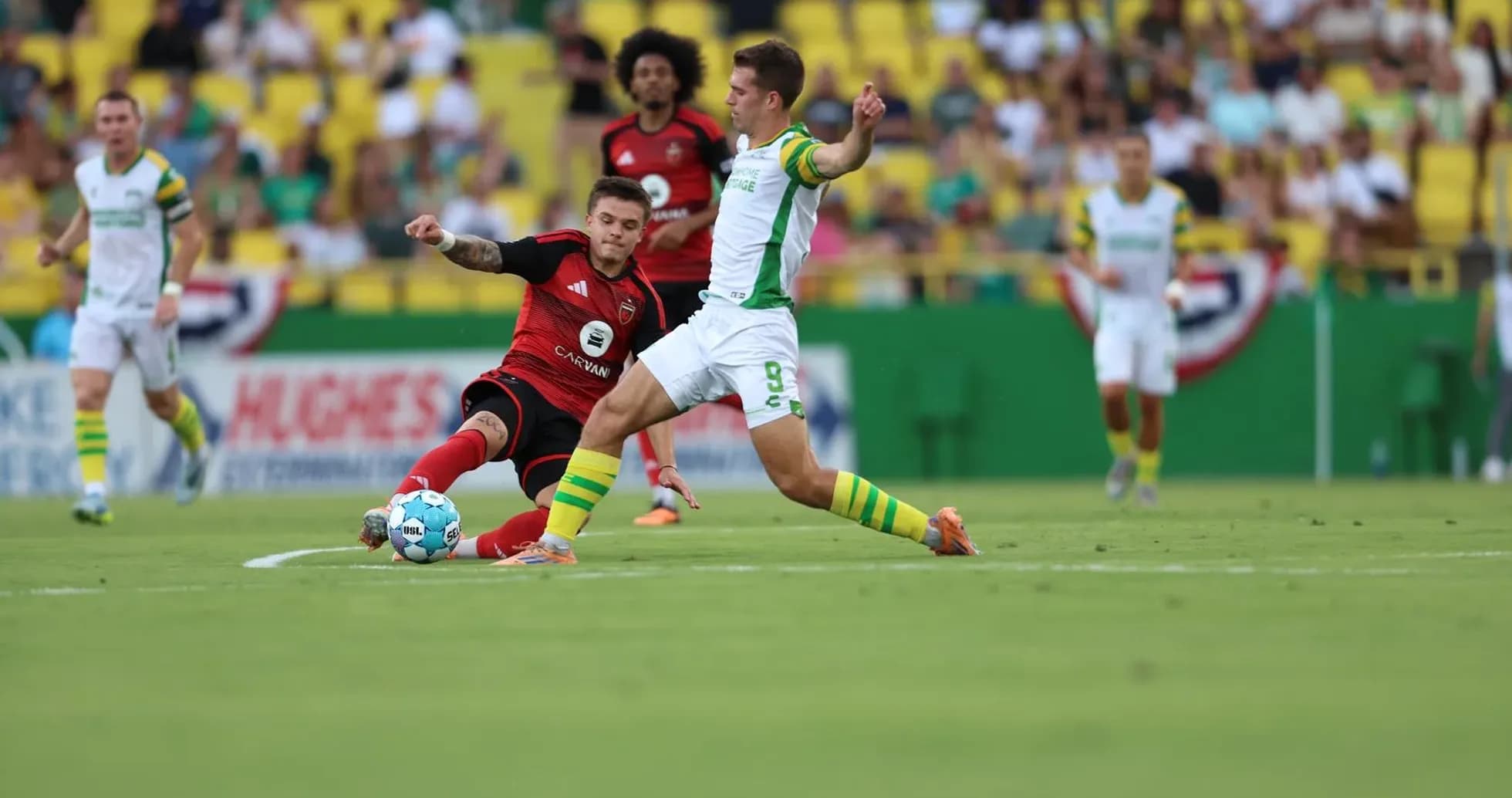 Tampa Bay Rowdies player tackles Hartford Athletic opponent