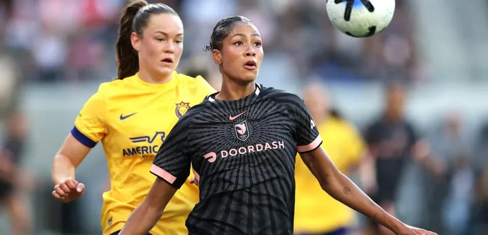 Player competing for the ball during NWSL match