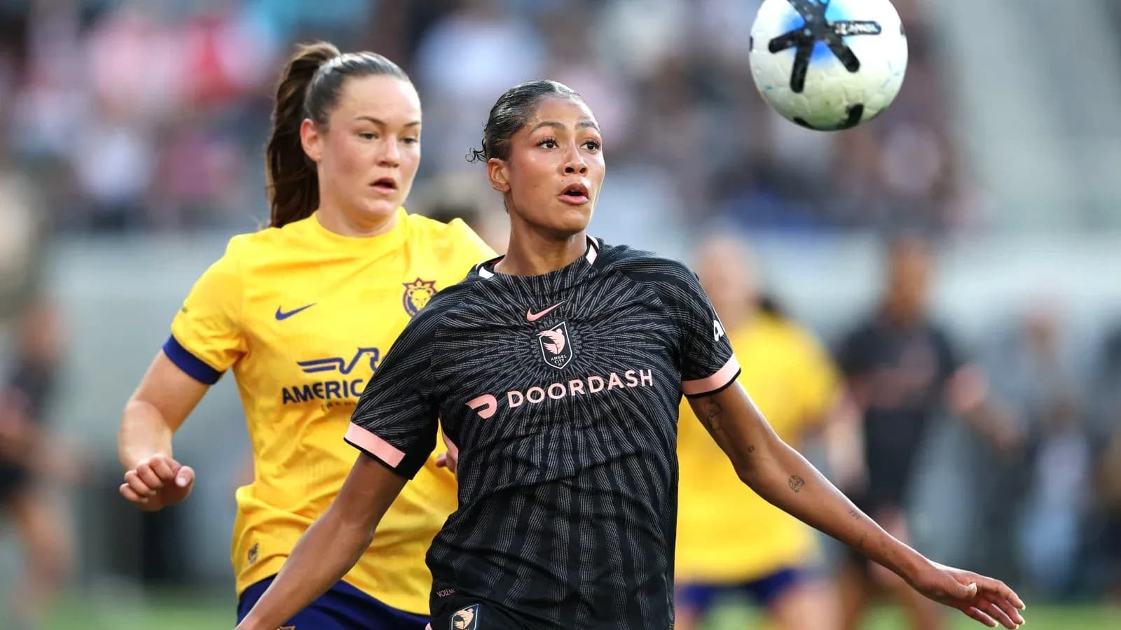 Player competing for the ball during NWSL match