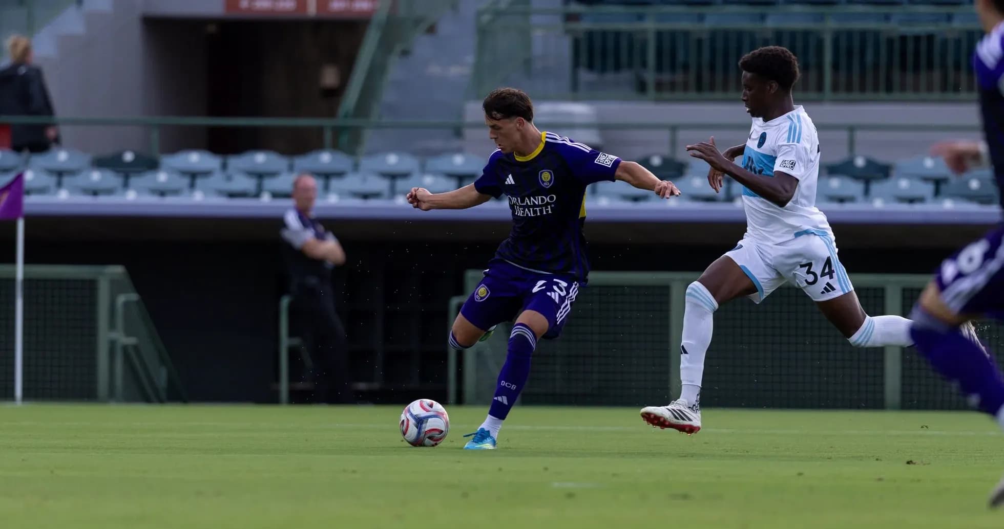 Orlando City II player dribbling against Crown Legacy Orlando City II player dribbling against Crown Legacy