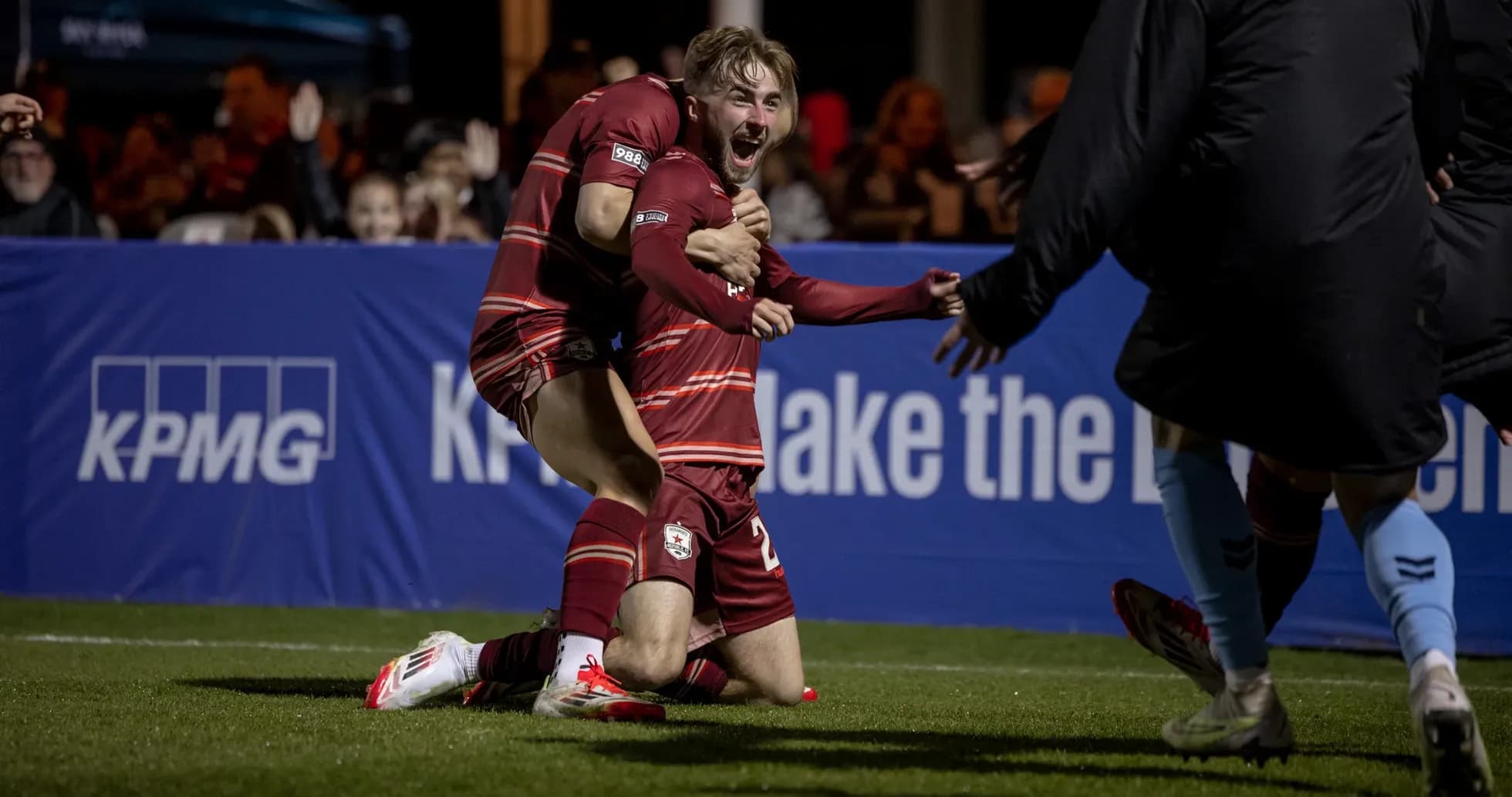 Players celebrating a goal during USL Championship match Players celebrating a goal during USL Championship match