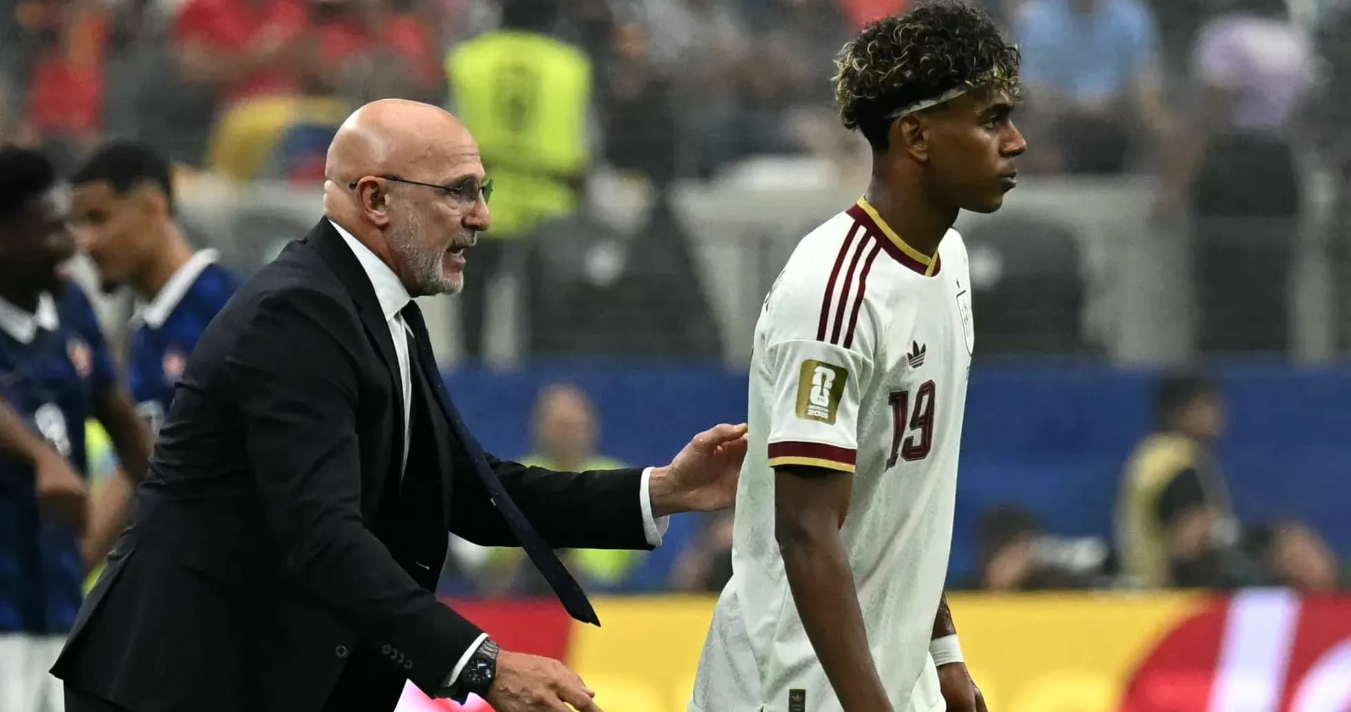 Coach interacting with player during a match Coach interacting with player during a match