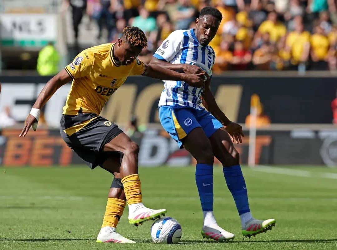 Brighton player challenging Wolves opponent for the ball Brighton player challenging Wolves opponent for the ball