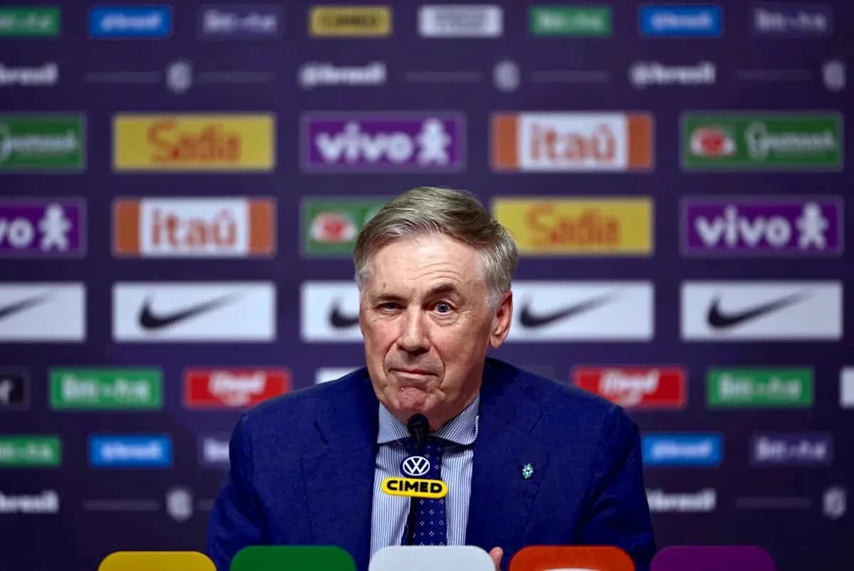 Manager speaking at press conference with logos behind Manager speaking at press conference with logos behind
